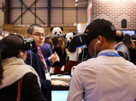 students wear VR headsets at a VR conference the