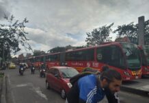 Various types of transport in Bogotá together on a street