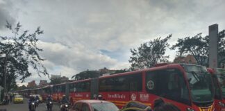Various types of transport in Bogotá together on a street