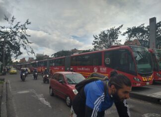 Various types of transport in Bogotá together on a street